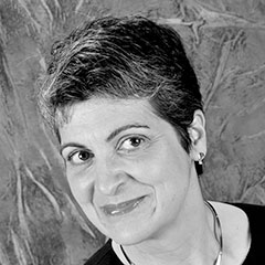 Lilly Feierabend, a light-skinned woman with short, dark hair. Picture is black and white.
