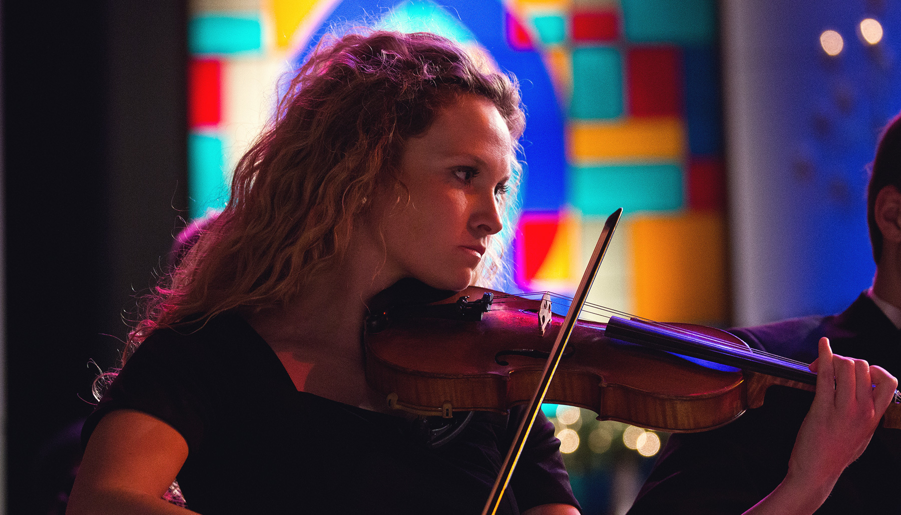 a young woman playing violin